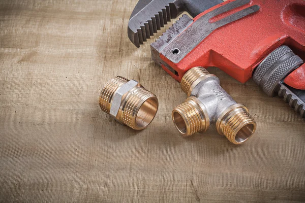 Plumbers wrench and plumbing fixtures