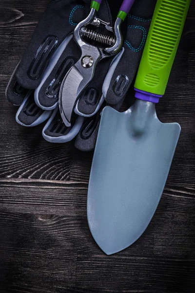 Protective gloves, garden pruner and spade