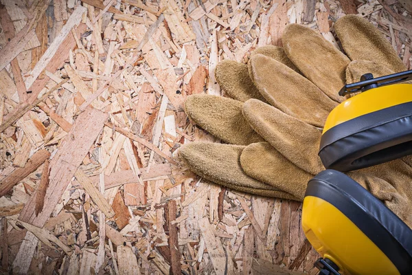 Protective leather gloves and earmuffs