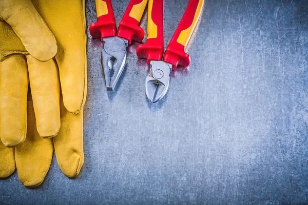 Protective gloves, pliers and wire-cutter
