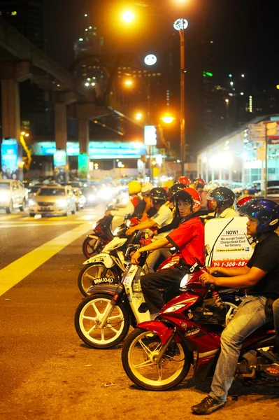 Motorcyclist on the road in Kuala Lumpur.