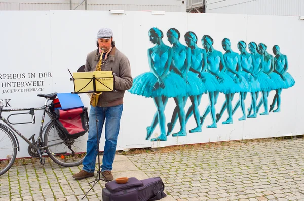 Unedentified musician playing music on the Berlin street