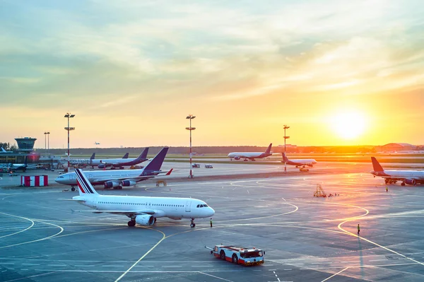 Modern airport at sunset