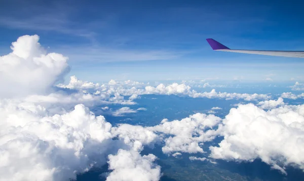 Plane wing and blue sky