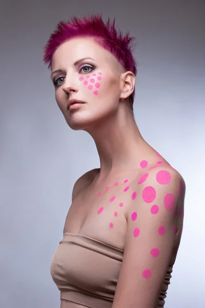 Color face and body art woman close up portrait