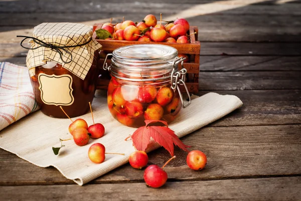 Apple jam in jar and apple fruits. Autumn still life.