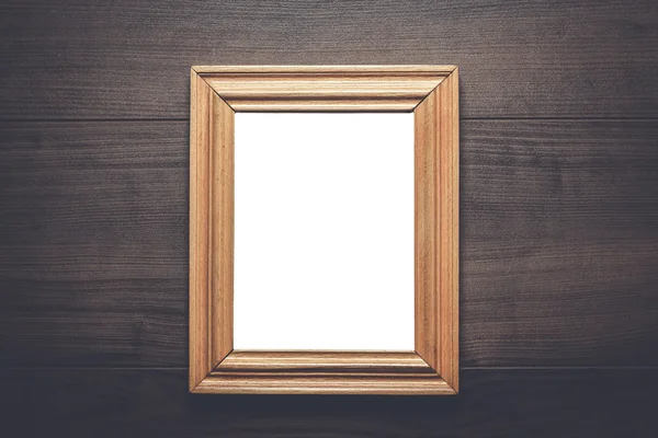 Empty frame with copy space on wooden wall