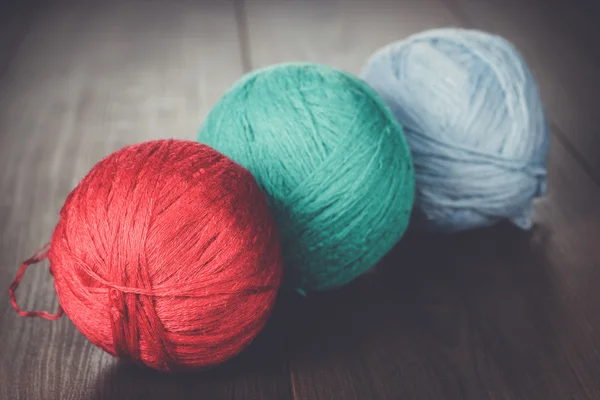 Three knitting balls of threads