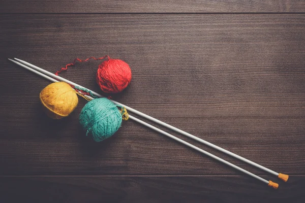 Knitting needles and ball of threads