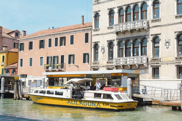 Landscape with the image of boats on a channel in Venice