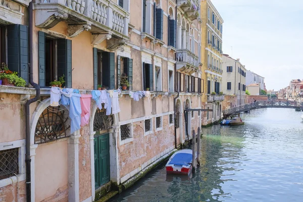 Landscape with the image of boats on a channel in Venice