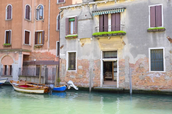 Landscape with the image of boats on a channel in Venice