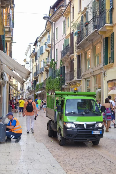 Street cleaning machine on a street of Verona