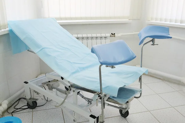 Gynecological chair in room