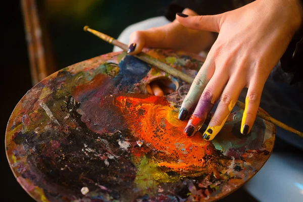 Artist's hand with the brushes