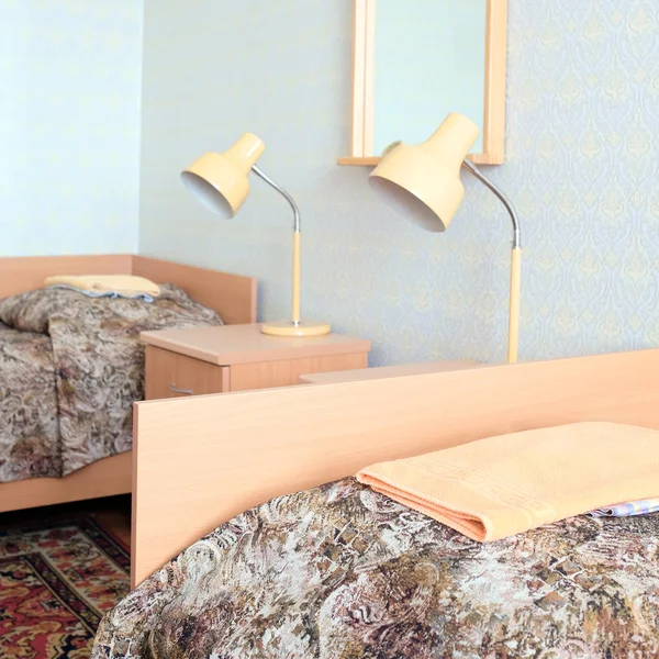 Beds in a simple motel room