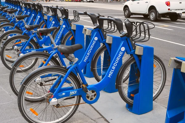 MELBOURNE, AUSTRALIA - JANUARY 31, 2016: A row of bicycles with Melbourne Bike Share logos on them.