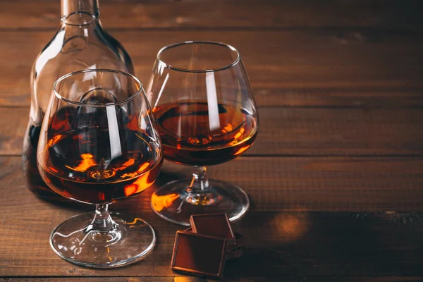 Glasses of cognac and bottle