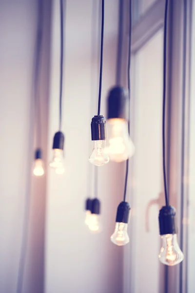 Light bulbs hanging at window