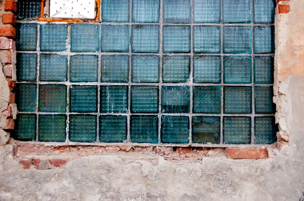 Tiled industrial window in abandoned urban place