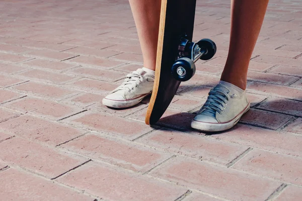 Sporty legs and skateboard