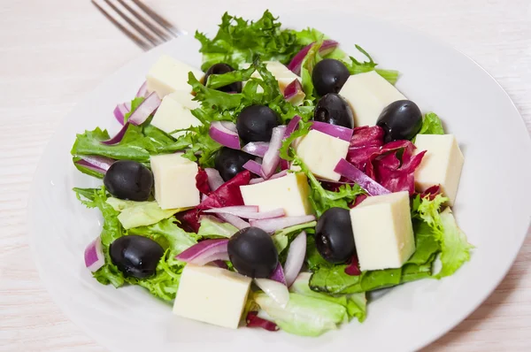 Fresh vegetables salad with cheese and olive