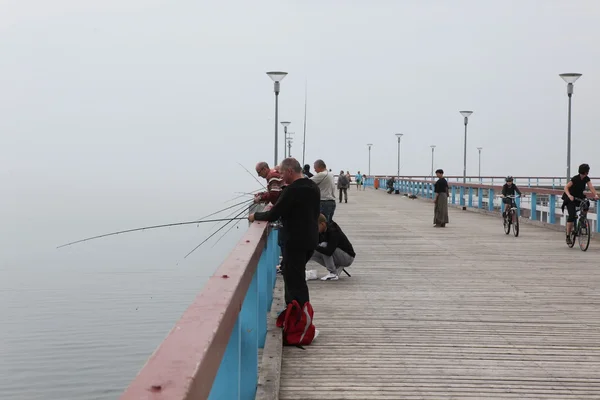 People fishing  in Palanga, Lithuania