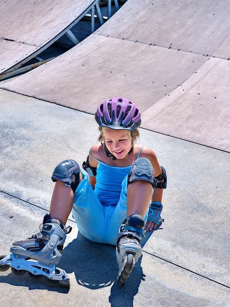Girl riding on roller skates .