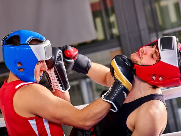 Two  men boxer wearing helmet  boxing .