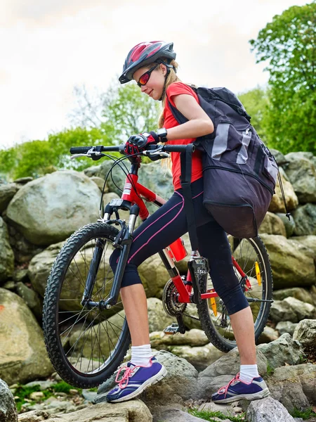 Bikes cycling girl into park.