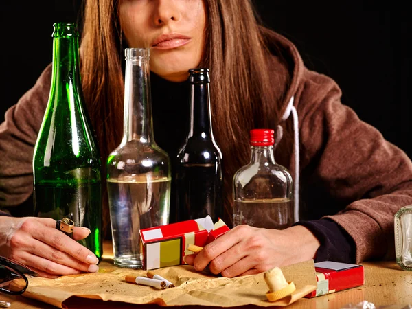 Girl in depression drinking alcohol. Drinking habits.