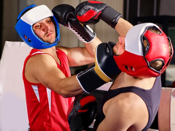 Two  men boxer wearing helmet  boxing .