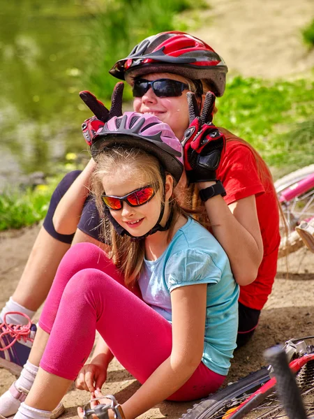 Bikes cycling family. Happy mother and daughter  rides bicycle.