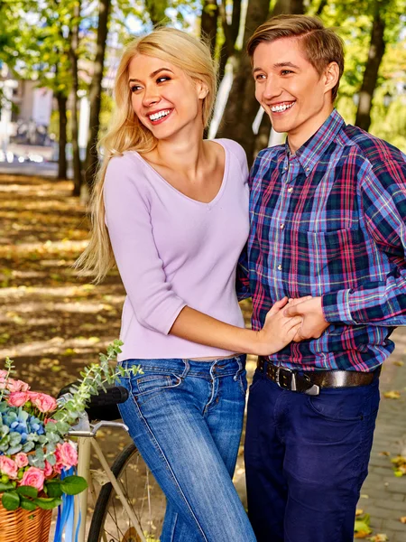 Couple with retro bike in the park