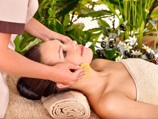 Woman getting facial massage