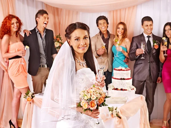 Bride and guests with cake