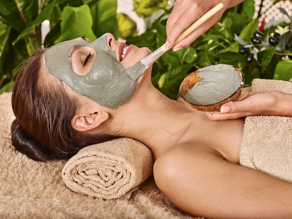 Woman with clay facial mask