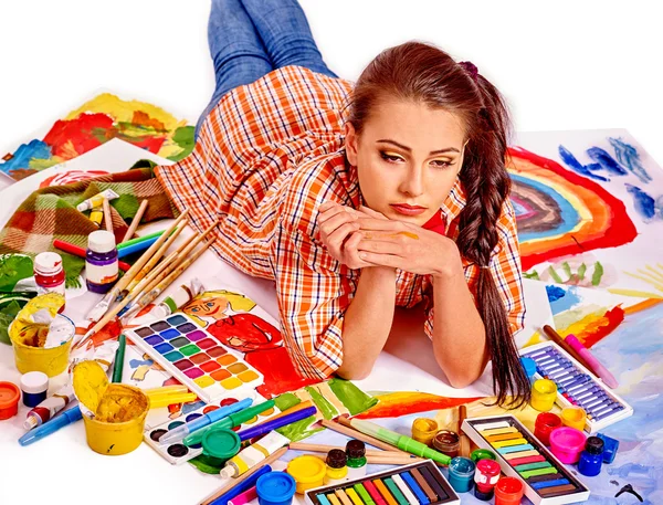 Unhappy artist woman on paint palette