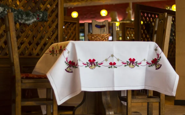 Table covered an embroidered tablecloth