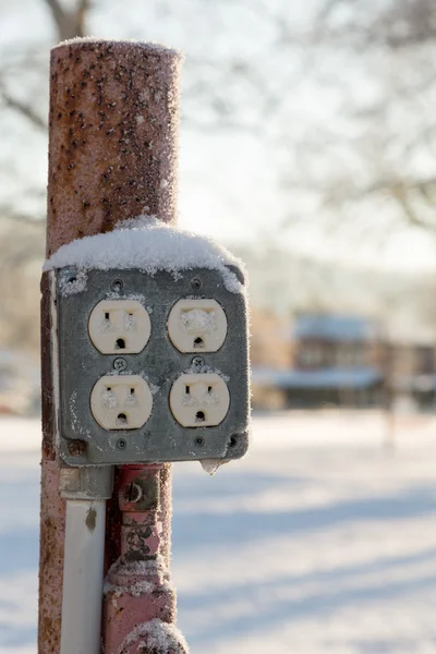 Close up of electric sockets outdoors in snow