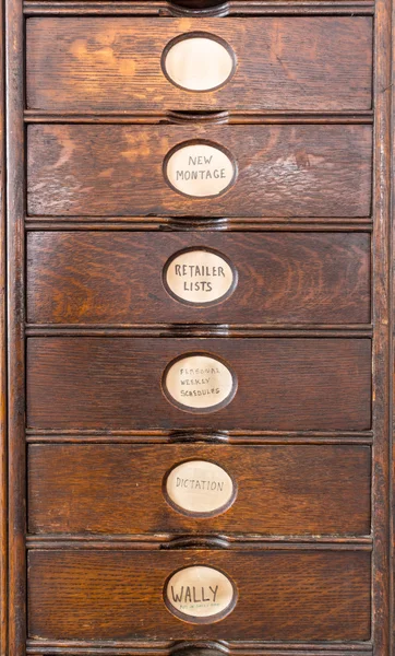 Old wooden filing cabinet with wooden drawers