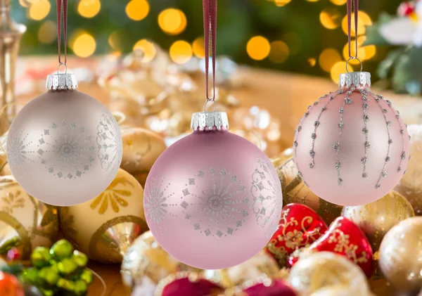 Three Christmas decorations on strings