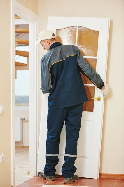 Carpenter worker at door installation