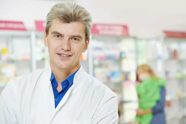 Confident pharmacy chemist man in drugstore