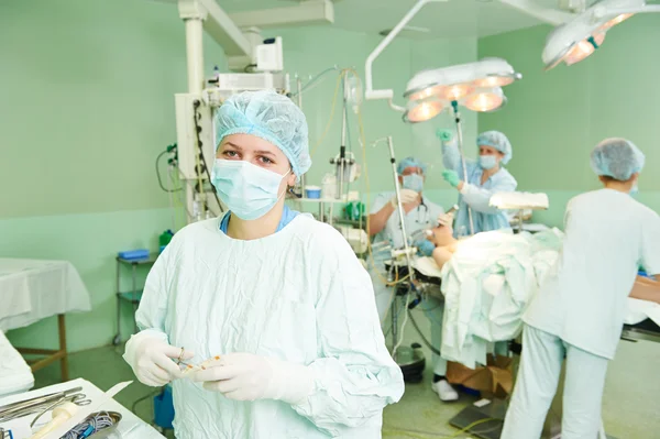 Surgeons team at cardiac surgery operation