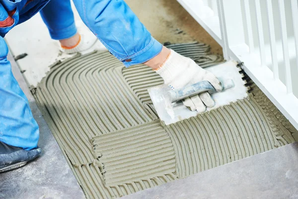 Tilers at industrial floor tiling renovation