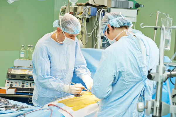 Surgeons team at cardiac surgery operation