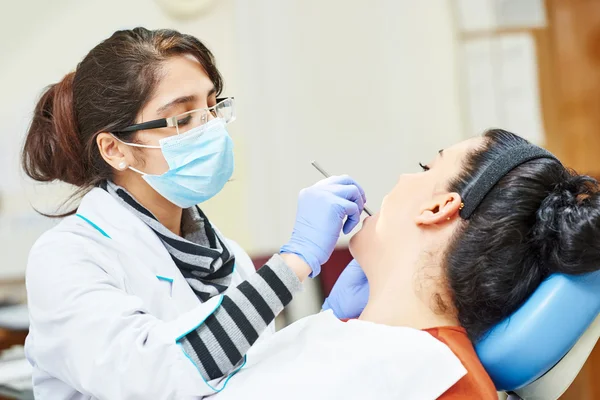 Female asian dentist doctor at work