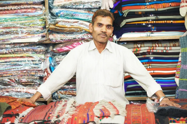 Small shop owner indian man at his souvenir store