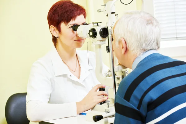Female ophthalmologist or optometrist at work